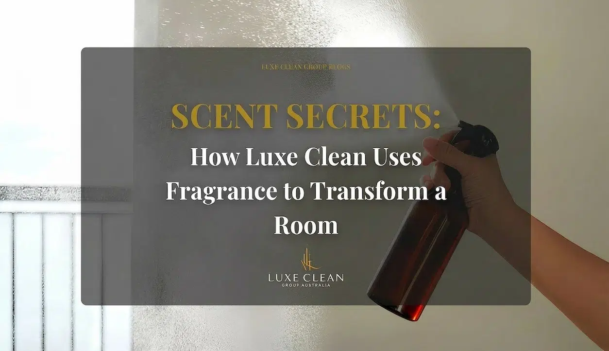 Cleaning supplies: spray bottle, squeegee, and colorful microfiber cloths on a white surface.